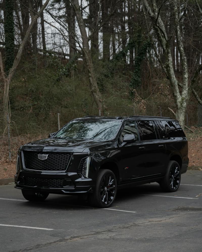 Black Cadillac Escalade three-quarter front view
